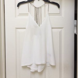 White top with gold chains