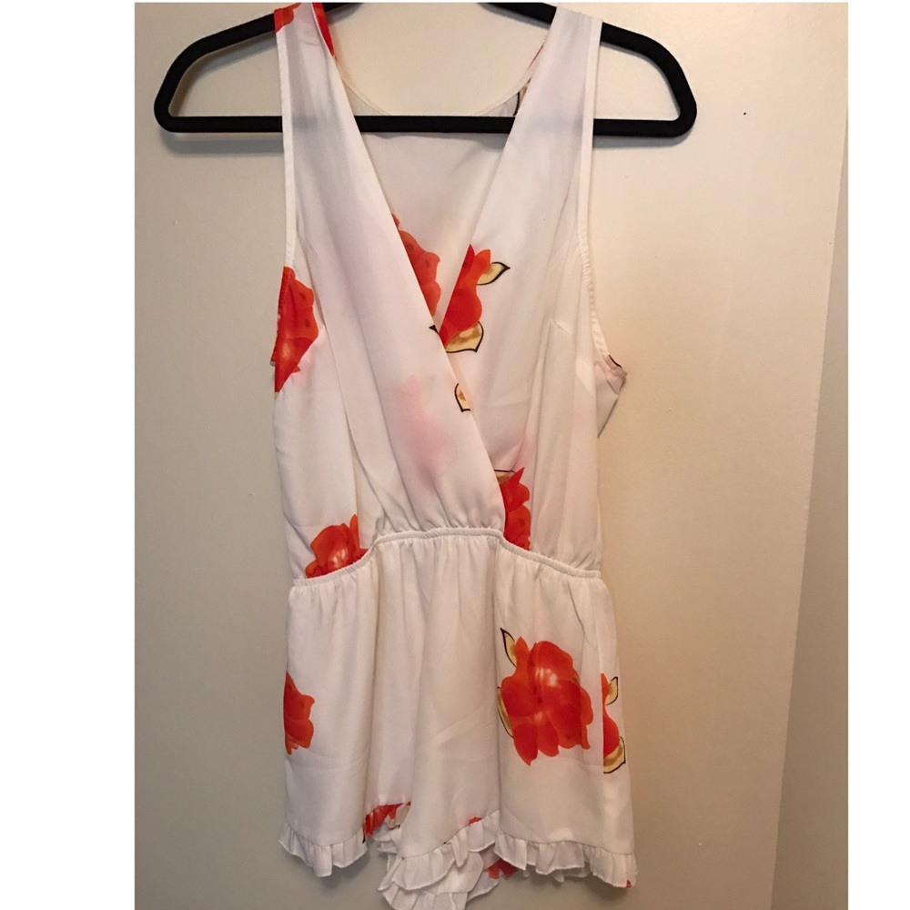White floral romper ruffle size small. Worn once!