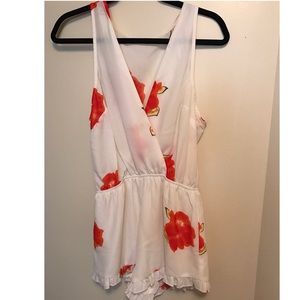White floral romper ruffle size small. Worn once!