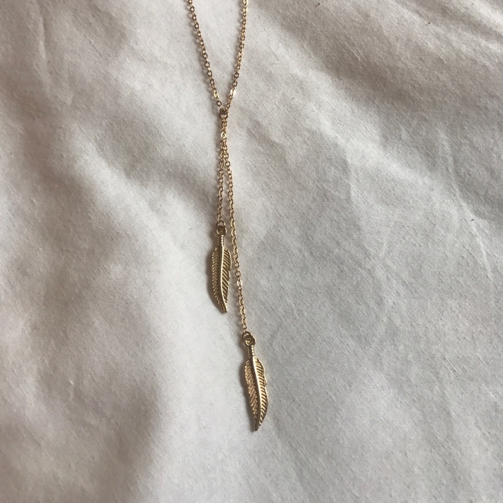 Gold feather necklace