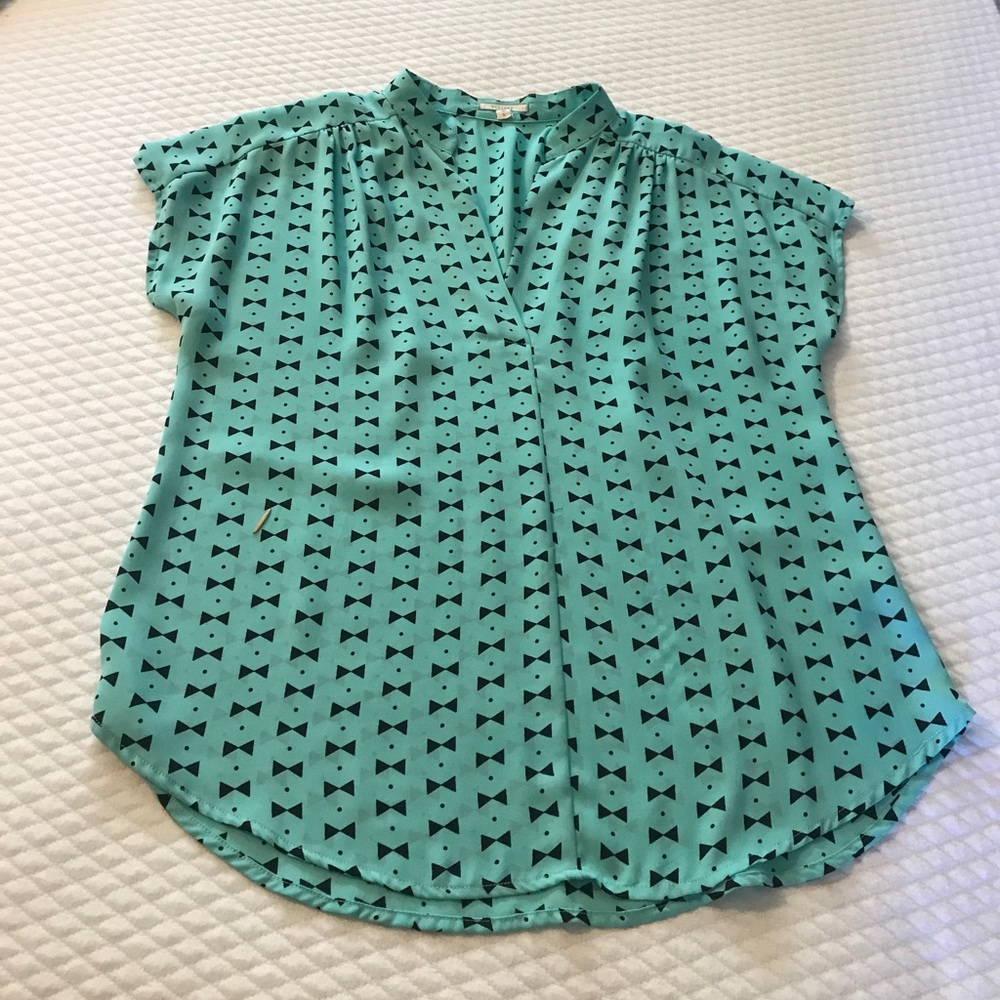 Bow tie and polka dot design blouse.