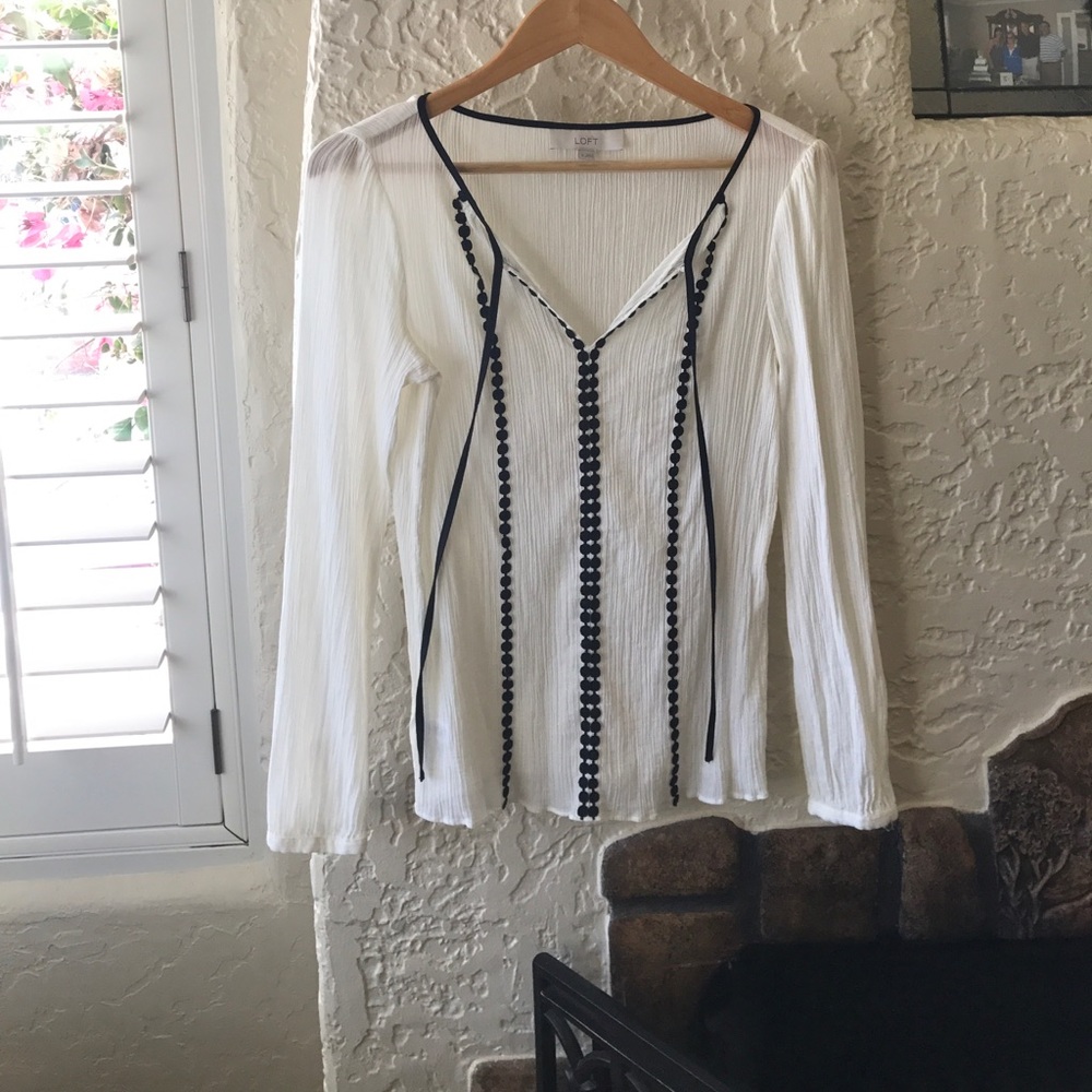 LOFT cream top with black ribbing on the front
