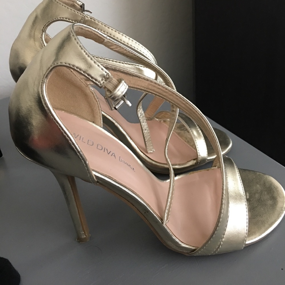 Gold heel sandals worn once.
