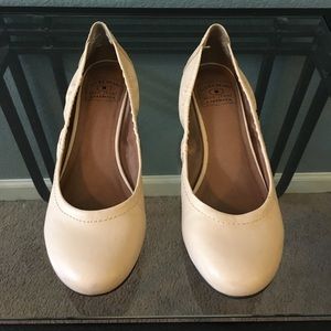 Cream colored flats with small wedge heel
