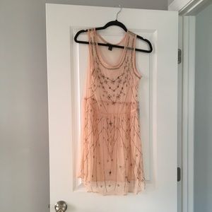Sheer pink overlay dress with silver beaded detail