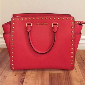 Red Michael Kors studded bag with strap