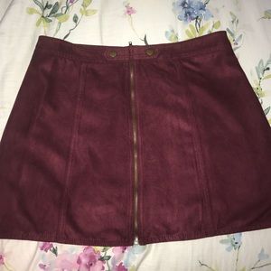 Maroon faux suede skirt.