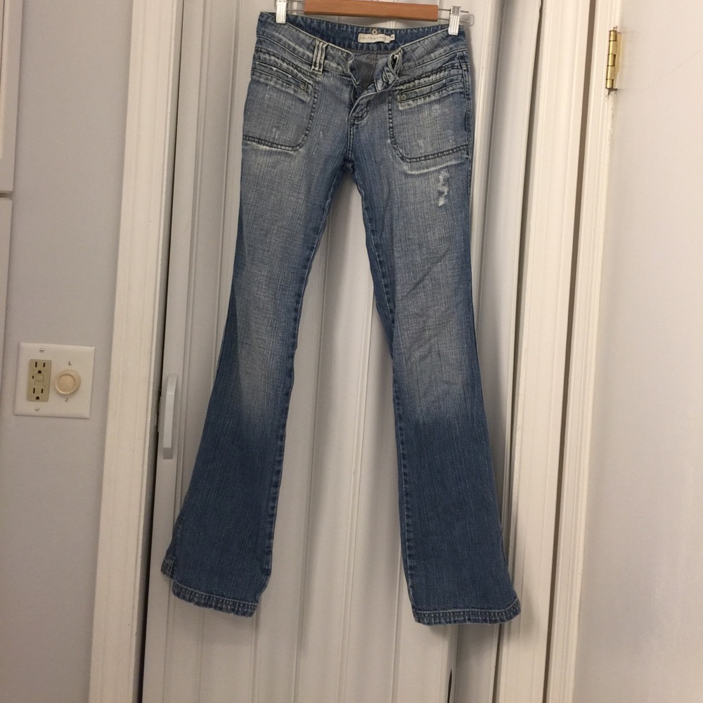 Cache cache light washed blue jeans.