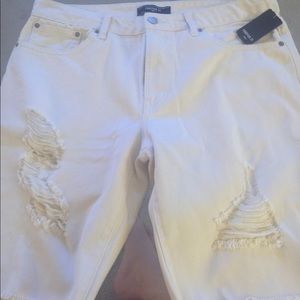 White ripped jeans with tags