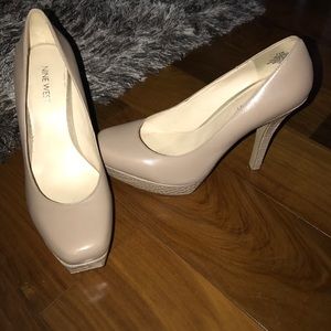 Nine West nude heels with snake skin design.