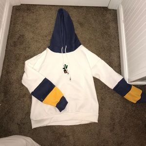 White with blue and yellow hoodie
