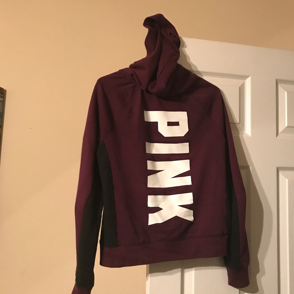 Pink jacket dark burgundy black and white letters