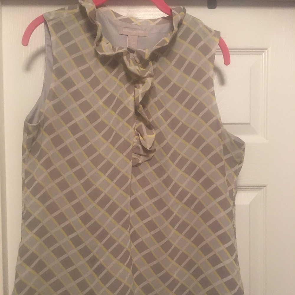 Sleeveless blouse with flowy detail