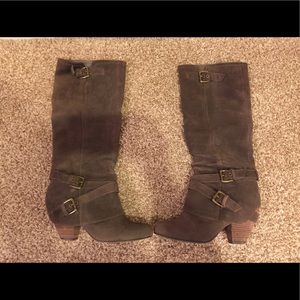 Taupe suede buckle boots.