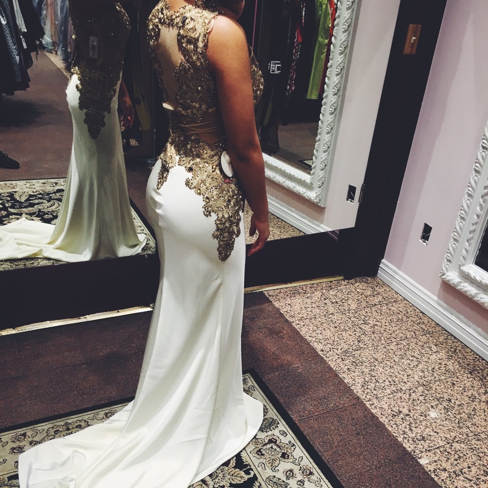 White and gold long tail dress.