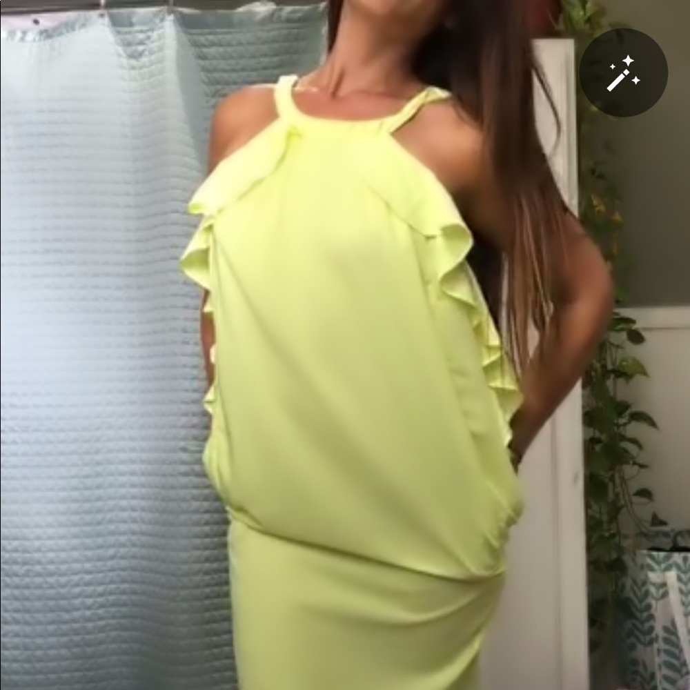 A medium-length neon yellow H&M halter dress
