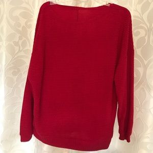Bright red off the shoulder rubbed sweater