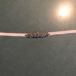 Elasticated sash with rhinestones in center