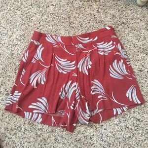 Burnt orange shorts with abstract floral print