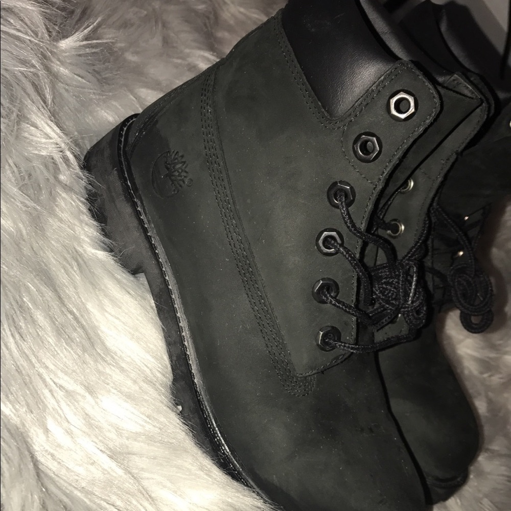 Boys black timberlands boots.