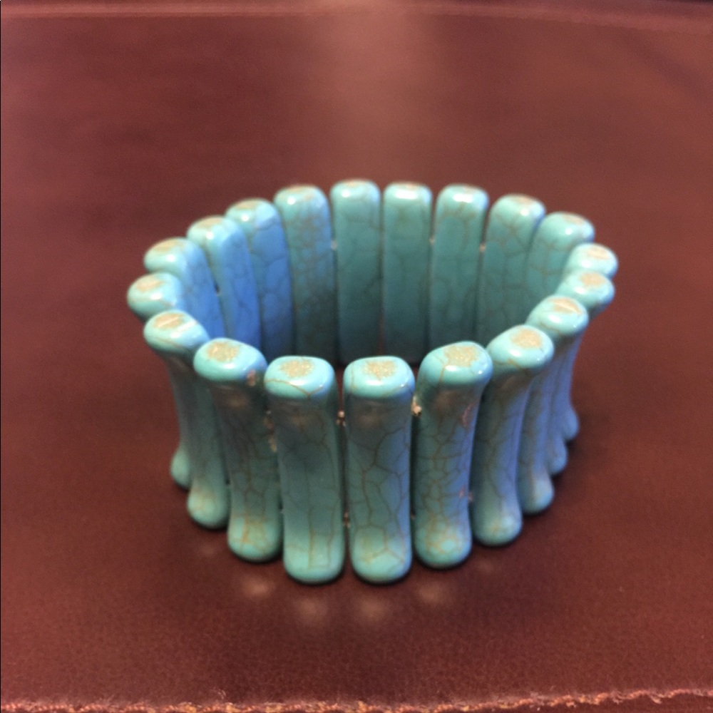 Aqua colored stretch bracelet.