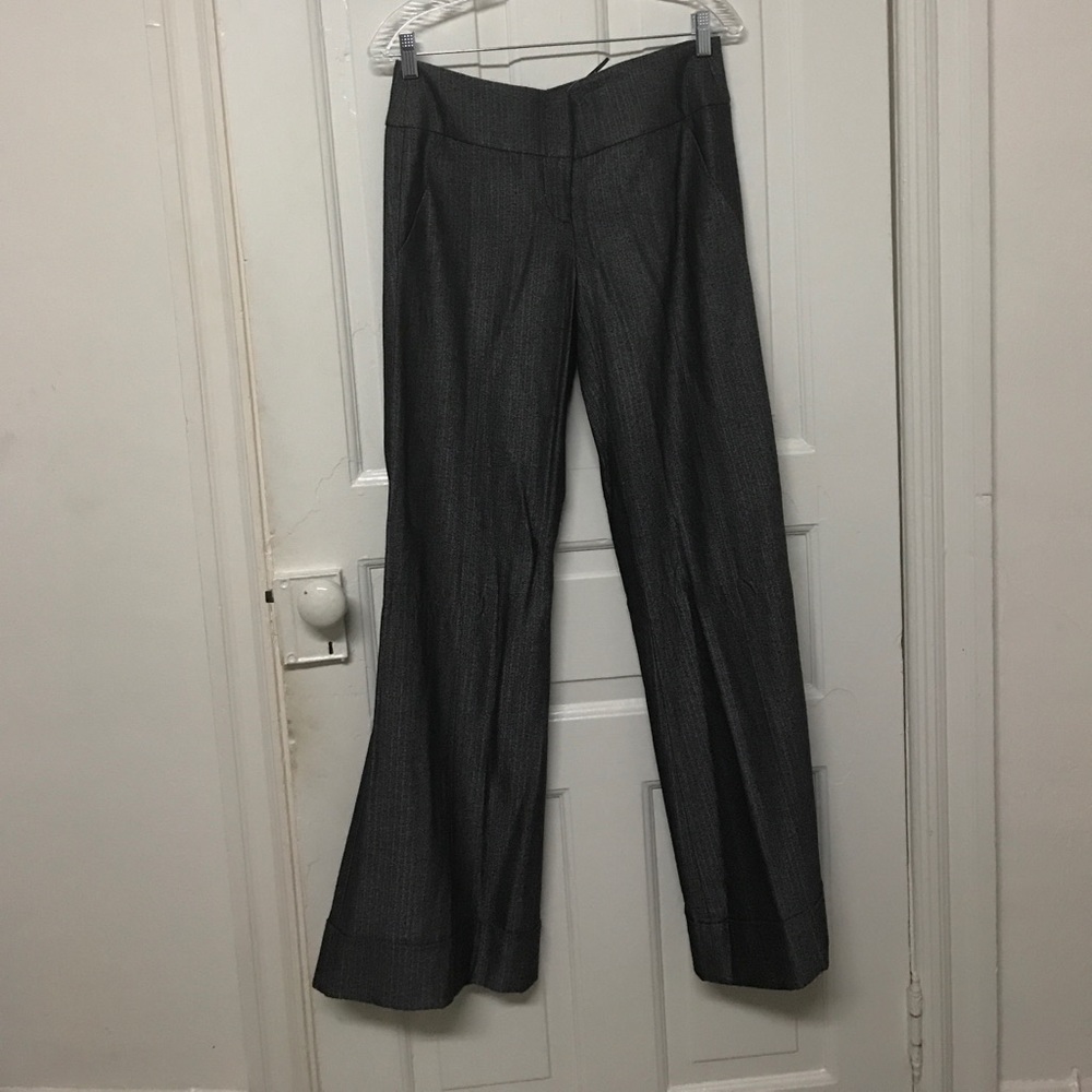 Cuffed black and grey suit pants with a banded top