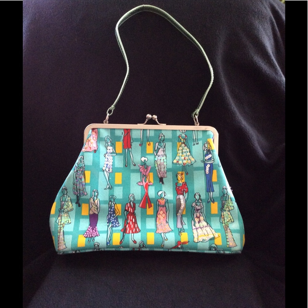 Fun handbag w/ prints of vintage dressed women