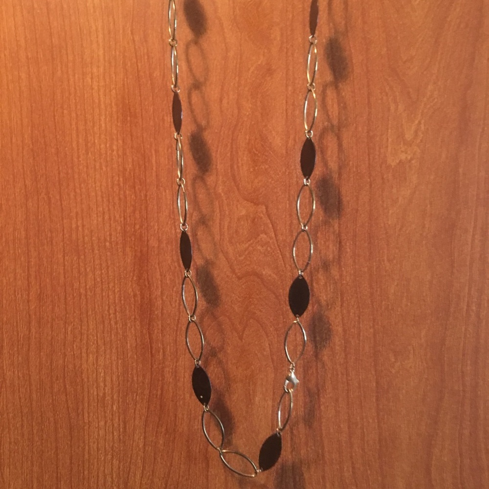 Brown and gold long necklace.