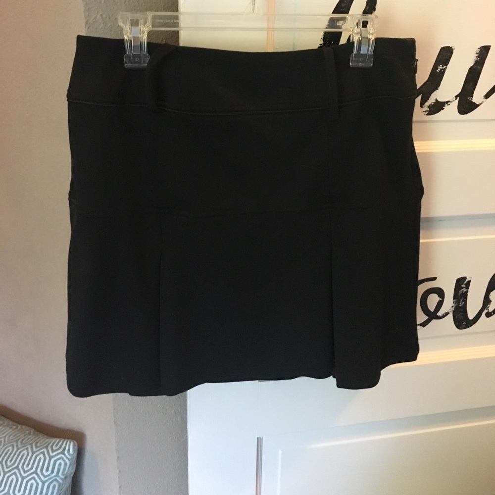 Black mini skirt with pleats