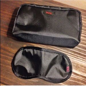 Tumi travel bag and eye mask.
