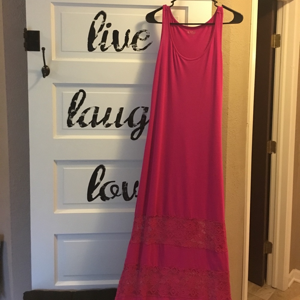 Bright pink dress with lace cutouts at bottom
