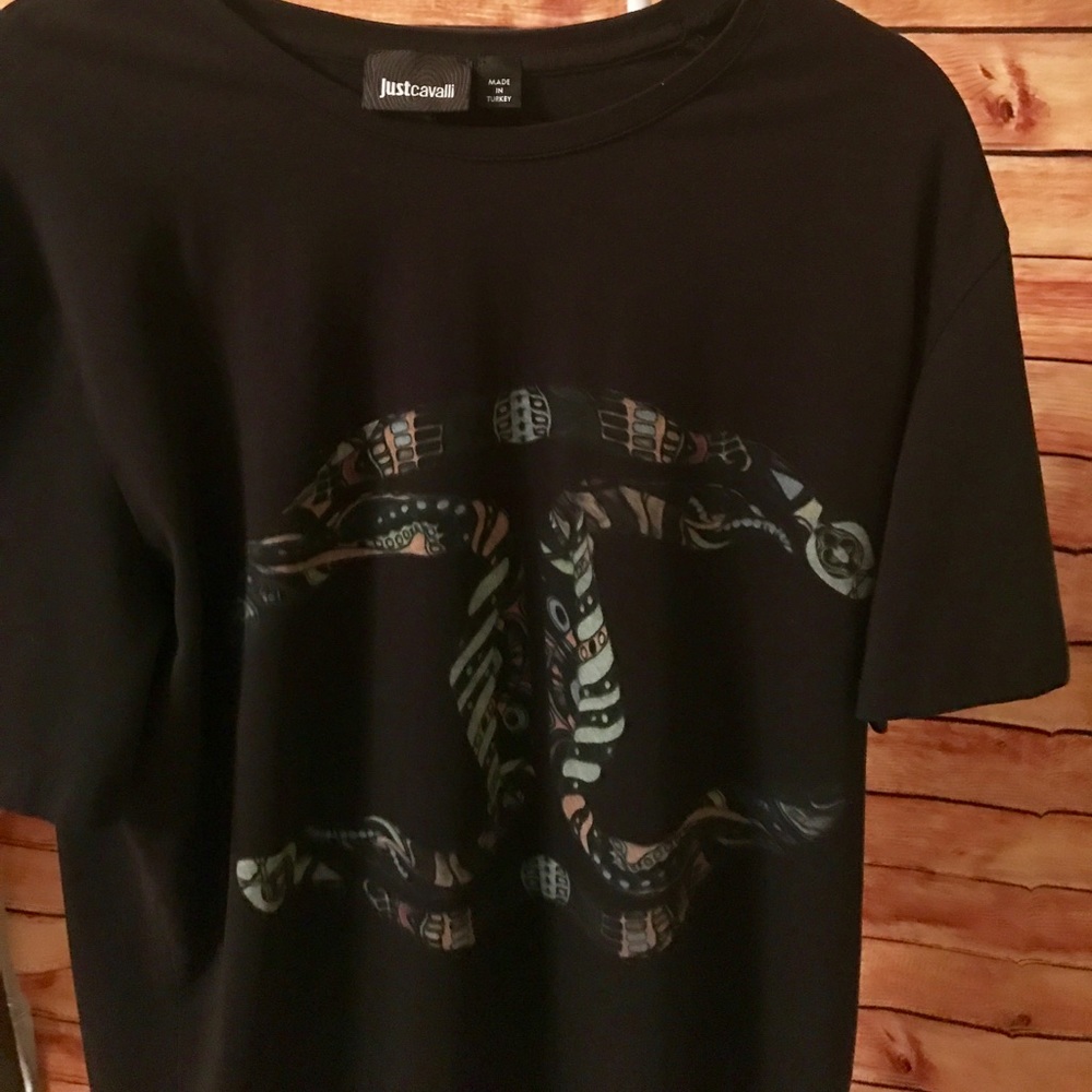 Men's t shirt runs small.