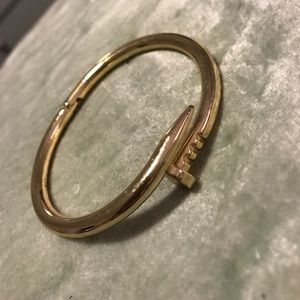Bent gold nail bracelet