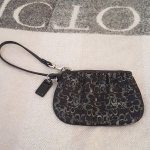 Black and silver Coach wristlet