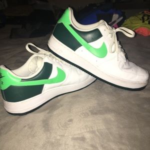 Green and white Nike Air Force ones
