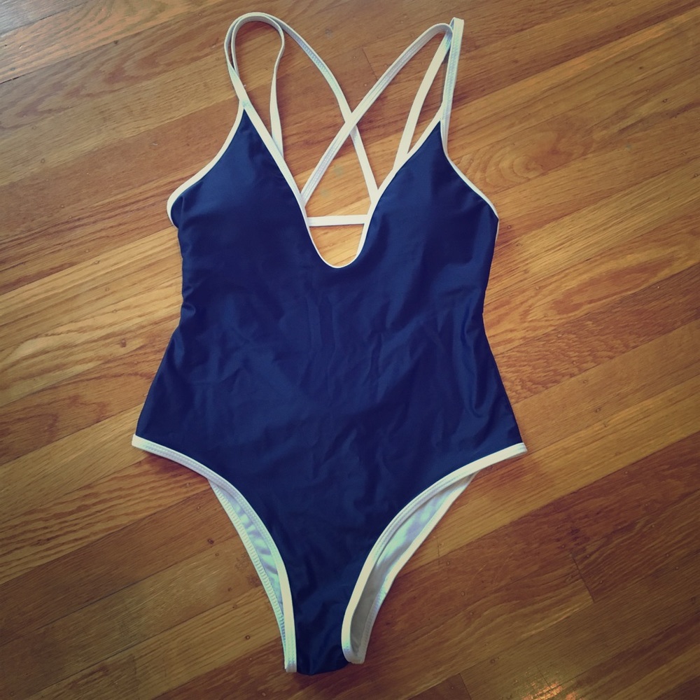 One piece swimsuit in Blue with white trim.