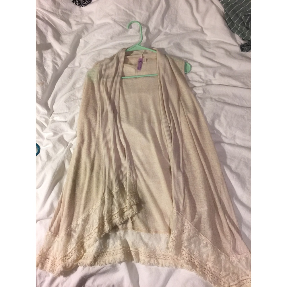Cream colored sleeveless cardigan