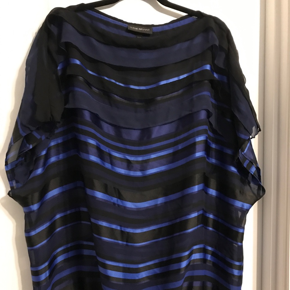 Deep blue ruffled blouse with a banded bottom
