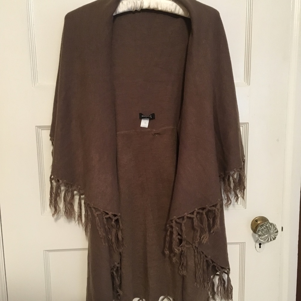 Sweater poncho with arm opening