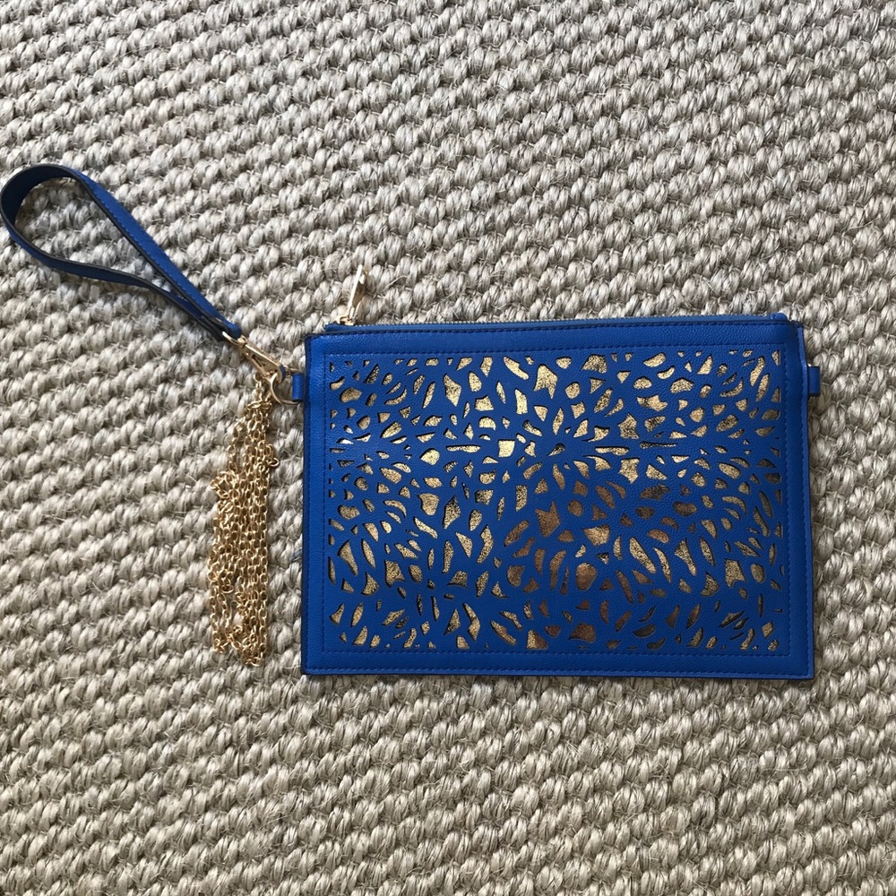 MMS brand cobalt blue laser cut wristlet