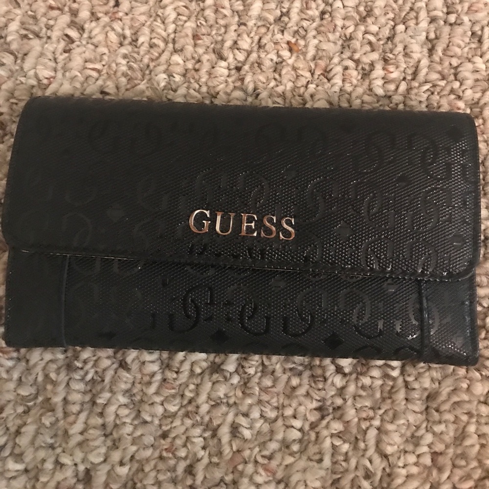 Guess women wallet.  Pre owned.