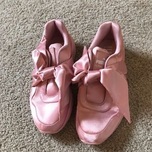 Pink Puma shoes with bows
