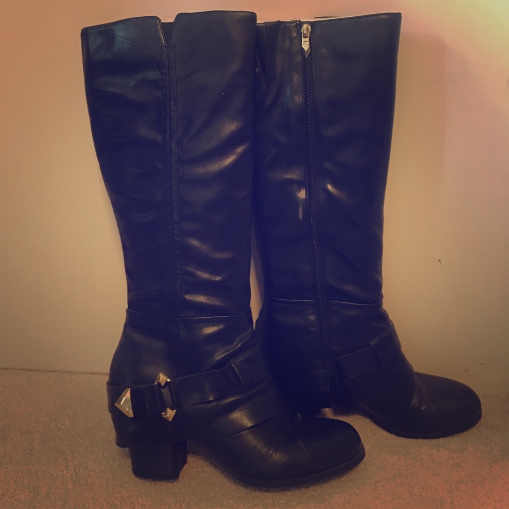 Black leather boots with gold hardware