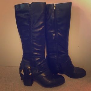 Black leather boots with gold hardware
