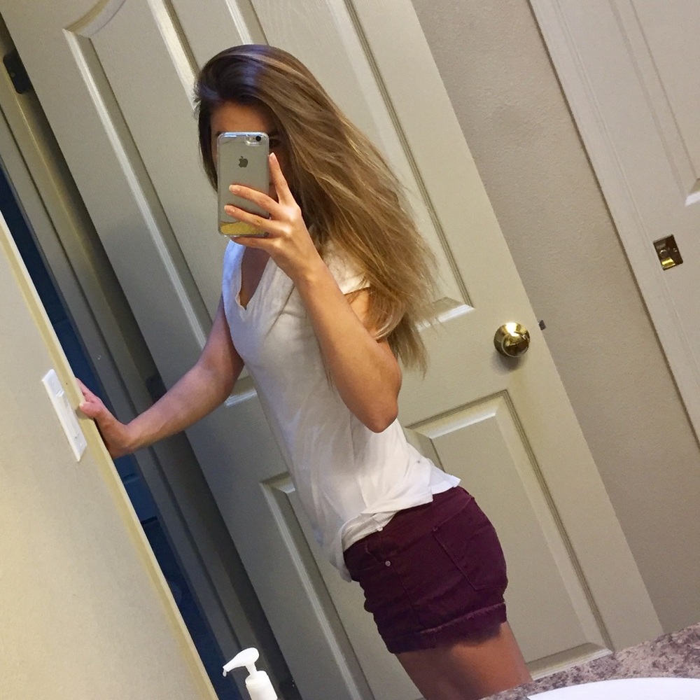 Deep burgundy jean shorts.