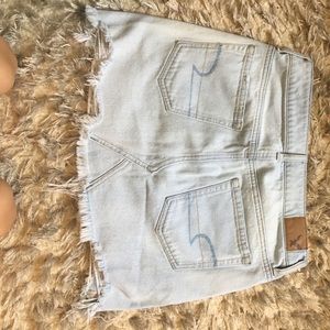 Light blue distressed jean skirt
