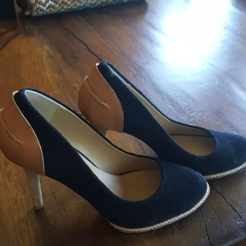 Stunning suede heels with leather trim.  4" heel