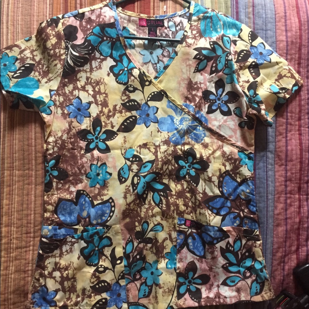 Scrub Top in a size small. Brand New by Actual.