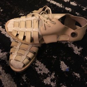 Off white sandal type shoes.