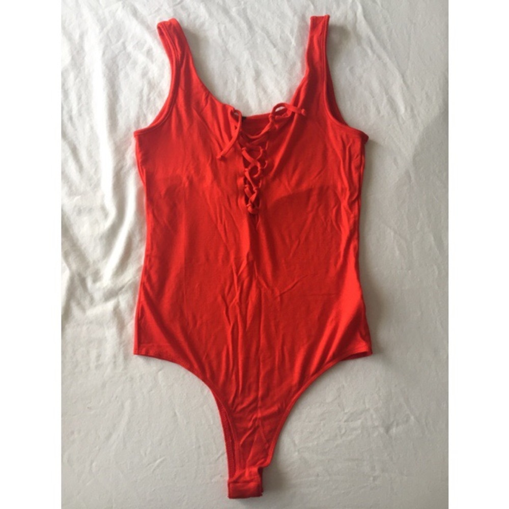 Red tie up body suit.